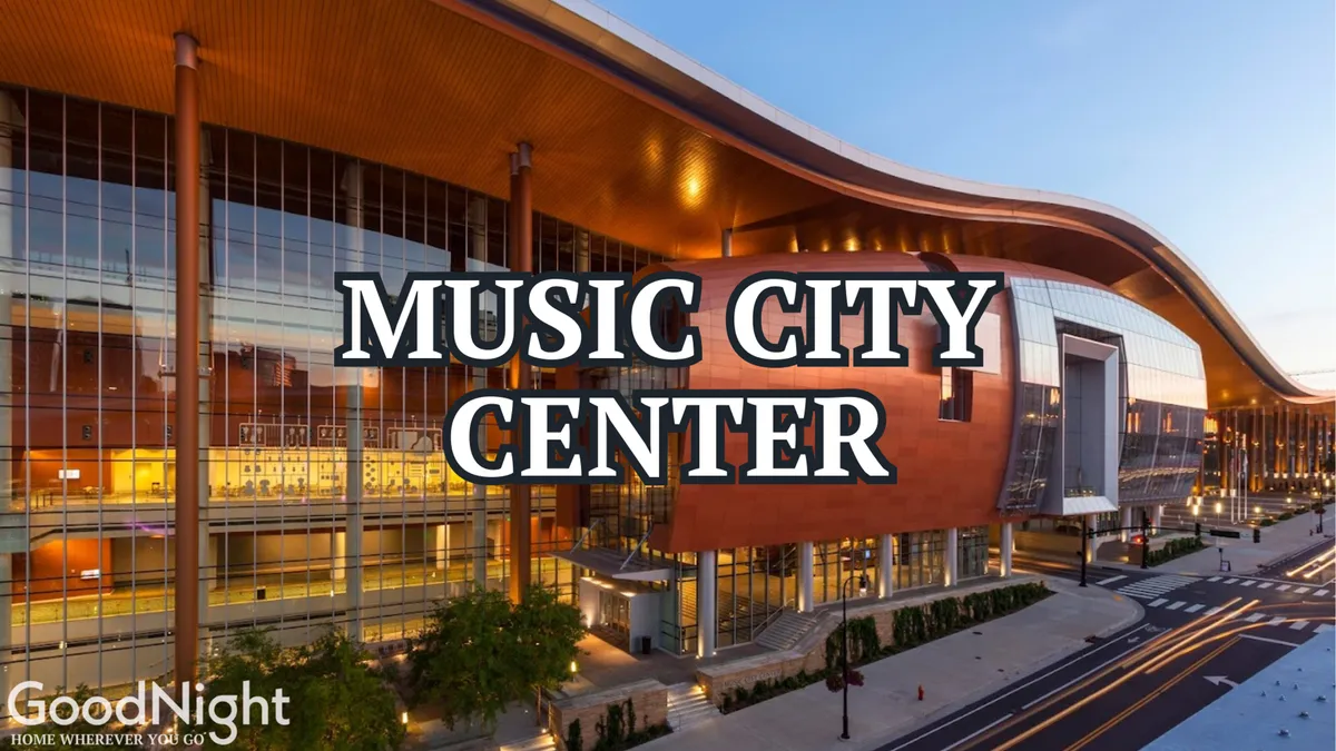 The modern exterior of a large building with sweeping glass windows and a distinctive curved roofline, hinting at newness and energy in the urban landscape. The contemporary design highlights the area's rapid development and vibrant atmosphere.