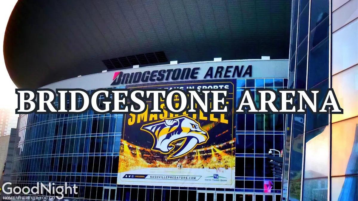 This exterior shot highlights the iconic Bridgestone Arena signage with the Predators logo and large event banners. The scene suggests an atmosphere charged with the anticipation of concerts, sporting events, and large-scale live entertainment, reflecting Nashville's status as a music and sports capital.